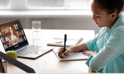 reading tutor student taking notes in reading tutoring session